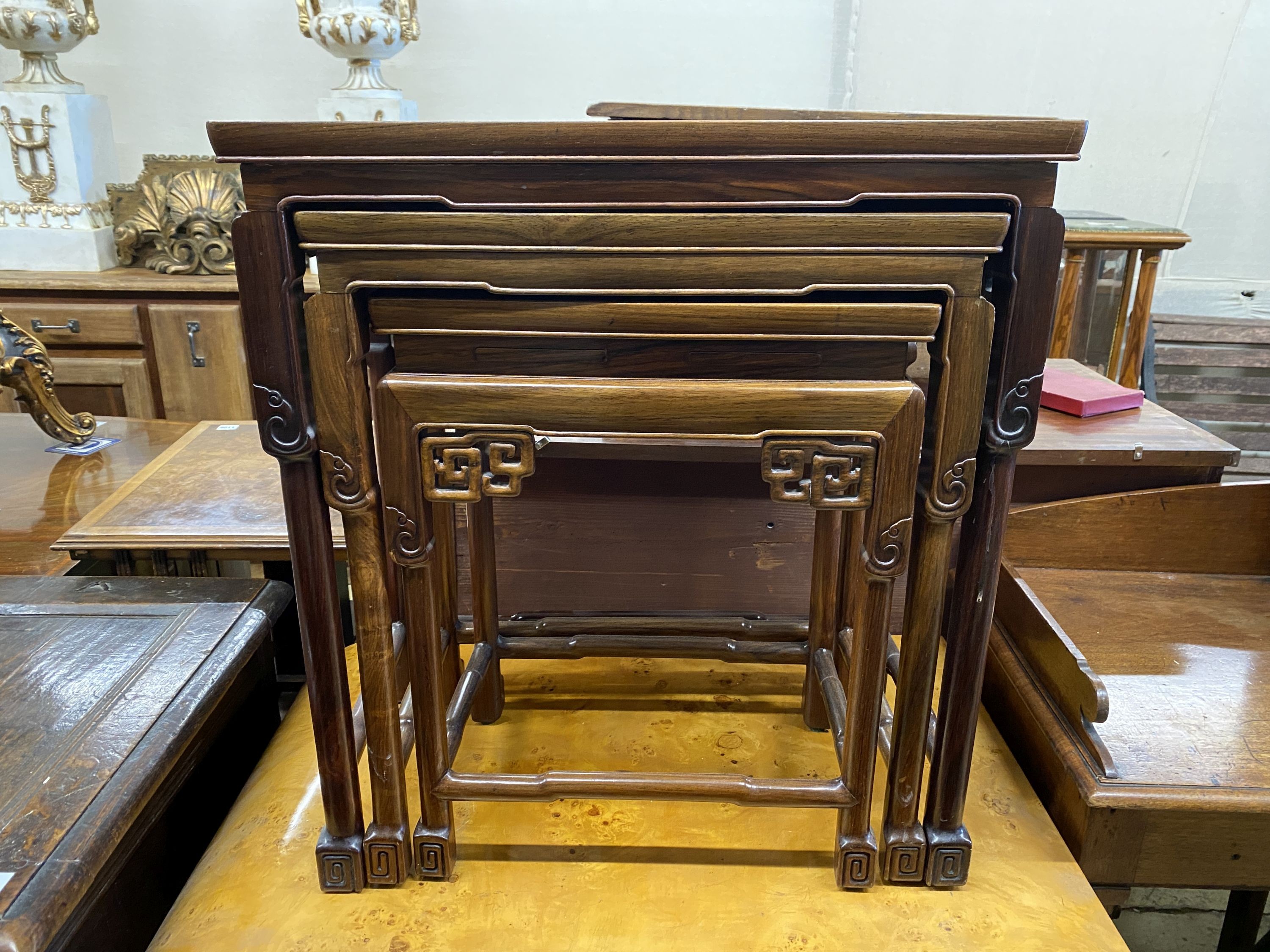 A nest of three Chinese rectangular tea tables, width 61cm, depth 36cm, height 66cm